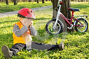 Embarassed little boy hiding his face