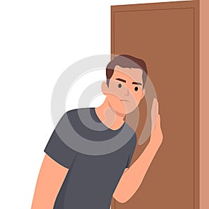 Embarrassed man leaned against door wanting to eavesdrop on someone else secret or hear conversations of people behind wall.