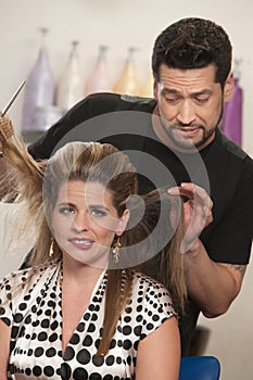 Embarrassed Woman with Hairdresser photo