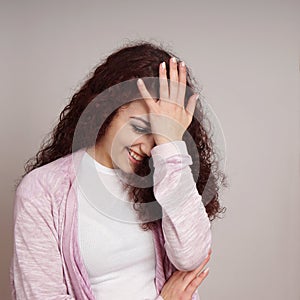 Embarrassed young woman facepalm photo