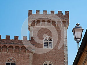 Embattled Tower of the Medieval Castle at the Entrance to the Village of Bolgheri photo