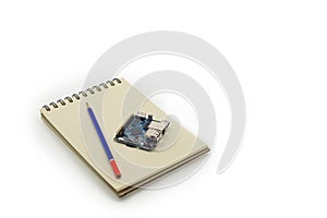 Embedded development board with notebook and pencil for engineering planning