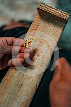 Embera Community of Medellin making Jewelry in Colombia photo