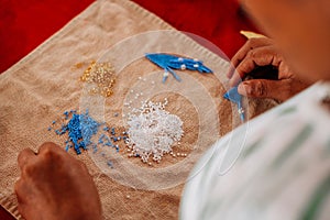 Embera Community of Medellin making Jewelry in Colombia photo