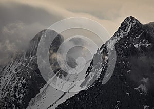 Emblematic mountain of Pedraforca with snow and foog