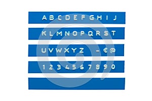 Embossed alphabet on blue plastic tape