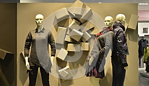 Embossed background and Autumn winter fashion Mannequins in fashion clothing mall photo