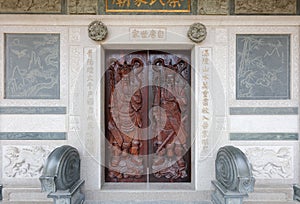 Embossed wooden door of Cai Family Temple in wudianshi historic site, adobe rgb