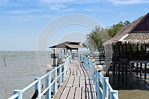 Embouchure bridge with restaurant and houses in the fishing village photo