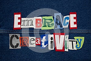 EMBRACE CREATIVITY word collage from cut out tee shirt letters, personal growth