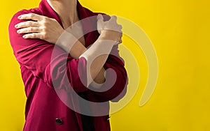 Embrace equity. Woman hug yourself dressed magenta jacket on yellow background. International women& x27;s day concept