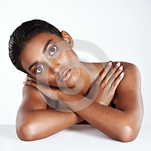 Embrace the gorgeousness of you. Studio shot of a beautiful young woman posing against a light background.