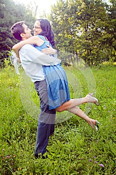 Embrace of happy couple outdoor