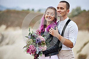 Embrace and kiss a couple in love on a spring morning in nature. Valentine`s day, a close relationship between a man and a woman.