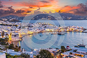 Embrace the warm hues of sunset in Mykonos Town Chora