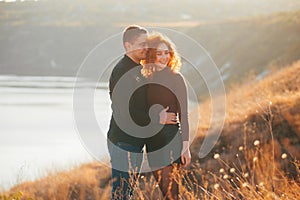 And embraced couple on the field having time together