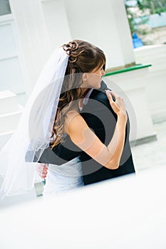 Embracing wedding couple. Bride and groom