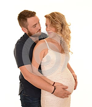 Embracing young expecting couple