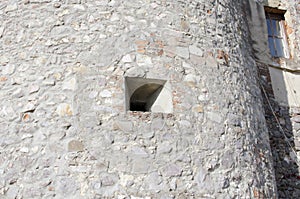 Embrasure, loophole in the wall of an old mountain fortress