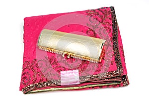 Embroided pink saree with golden purse