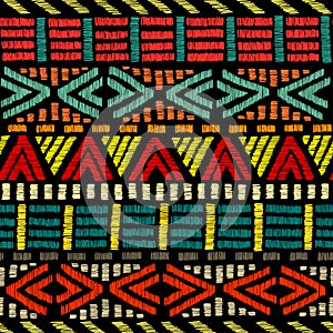 Embroidered ethnic seamless pattern. Aztec and tribal motifs. Striped ornament hand drawn. Print in the bohemian style. Vector
