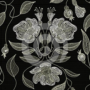 Embroidered flowers and leaves ornament on a dark background