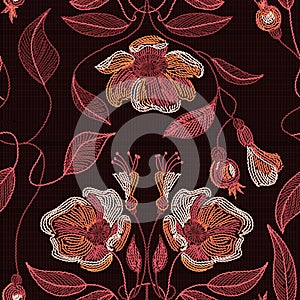 Embroidered flowers and leaves ornament on a dark background