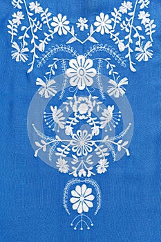 Embroidered pattern on blue