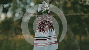 Embroidered towels hanging on a tree branch