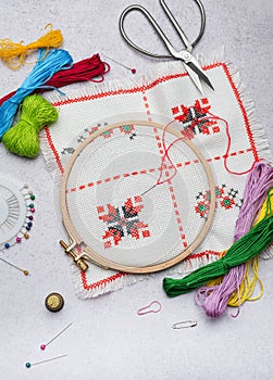 Embroidery with colored threads and various sewing accessories