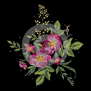 Embroidery colorful floral pattern with vinous dog roses. photo
