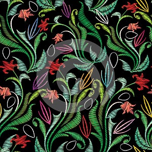 Embroidery colorful floral seamless pattern. Tapestry vector background with vintage grunge embroidered flowers, swirl green