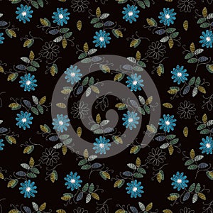 Embroidery design. Beautiful seamless pattern with blue flowers on black background. Fancywork print for fabric photo