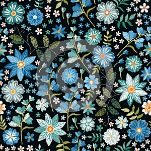 Embroidery ditsy seamless pattern with beautiful wild flowers in blue colors. Trendy print for fabric, textile, wrapping paper