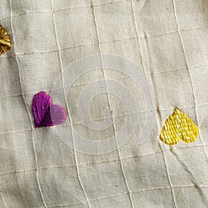 Embroidery hearts on a cloth