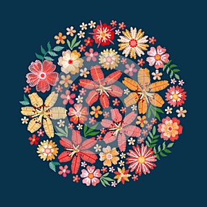Embroidery lily and garden flowers. Colorful pattern on dark blue background. Floral ornament in the form of a rosette