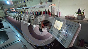 Embroidery Machine. Embroidery machine with computer control. Industrial embroidery equipment. Programmable embroidery machine.