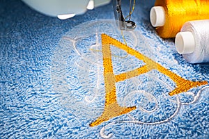 Embroidery machine and logo design on towel