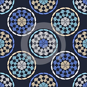 Embroidery. A mosaic of striped geometric figures. Seamless pattern. Design with manual hatching. Textile. Ethnic boho ornament.