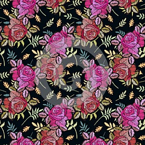 Embroidery pink and red rose flowers on the background with green leaves. Fashion design. Print for fabric and textile