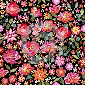 Embroidery seamless pattern with beautiful pink flowers. Ditsy floral print. Fashion design. Vector embroidered illustration