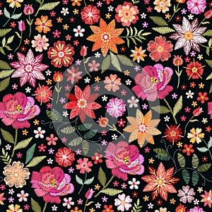 Embroidery seamless pattern with bright flowers on black background. Fashion design for fabric, textile, wrapping paper. Fancywork