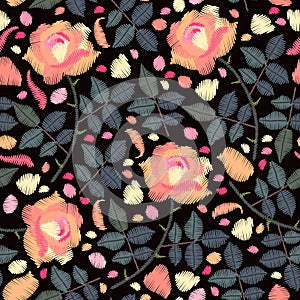 Embroidery seamless pattern with rose flowers, petals and leaves on black background. Fashion design for fabric. Fancywork print