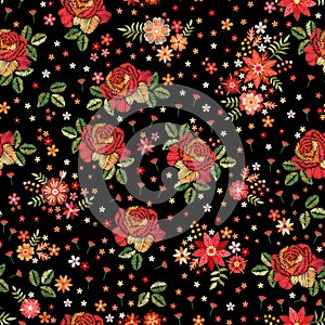 Embroidery seamless pattern with roses and wild flowers on black background. Trendy design for fabric and textile. Fancywork print photo