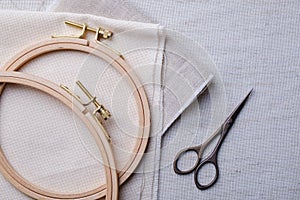Embroidery set. White linen fabric, embroidery hoop, colorful threads and needls.