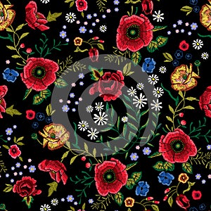 Embroidery traditional seamless pattern with red poppies and roses.