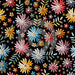 Embroidety seamless pattern with colorful flowers on black background. Fancywork print. Bright summer design photo