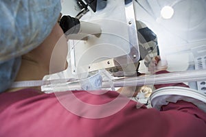 Embryologist adding sperm to egg