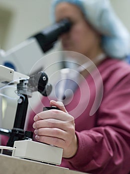 Embryologist perfoming intra cytoplasmic sperm inj