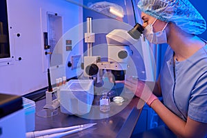 Embryologist preparing cell samples for cryopreservation procedure